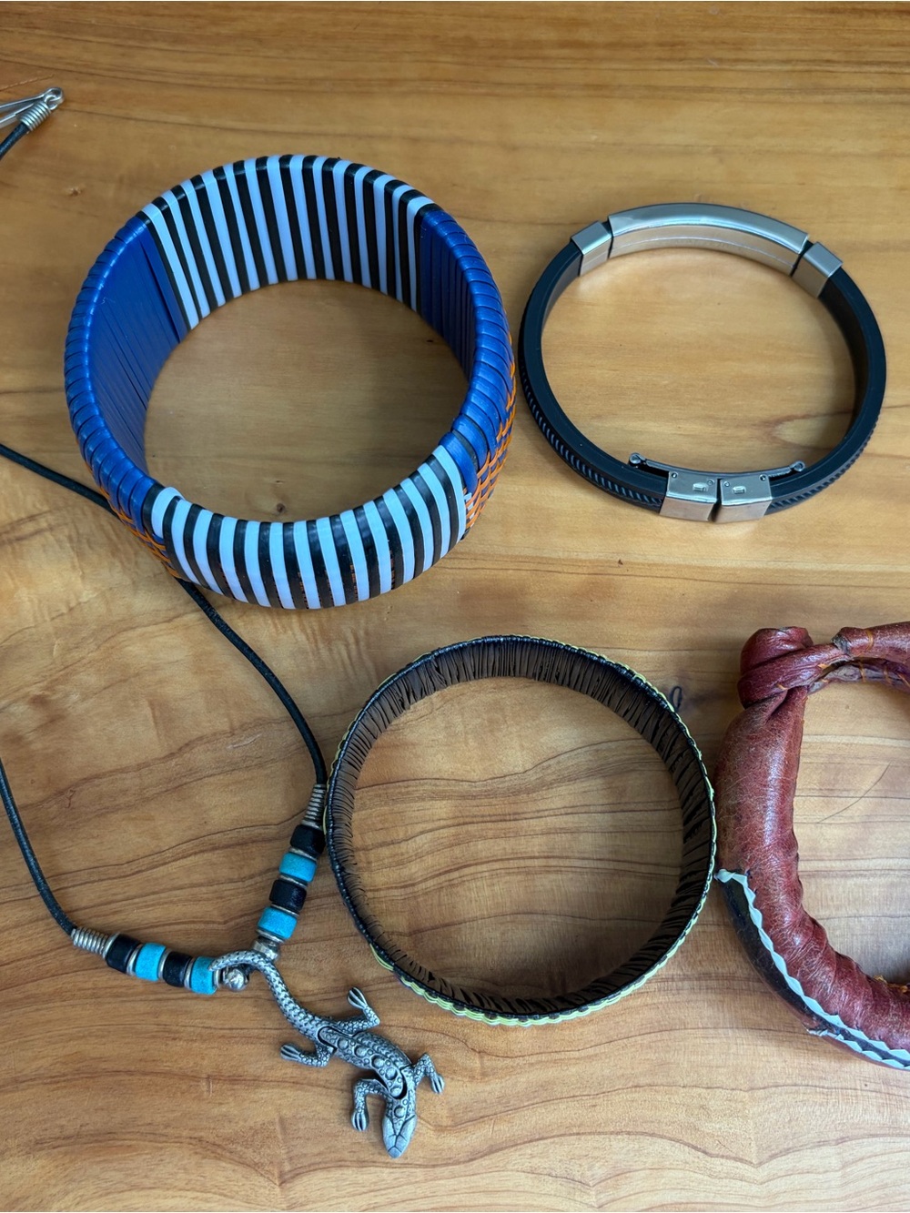 Four Light Weight Bracelets and a Lizard Necklace